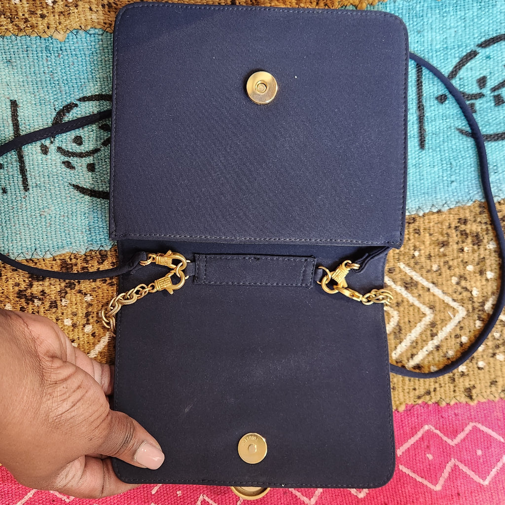 Original photo: flap open showing the magnetic snap and gold chain clasps