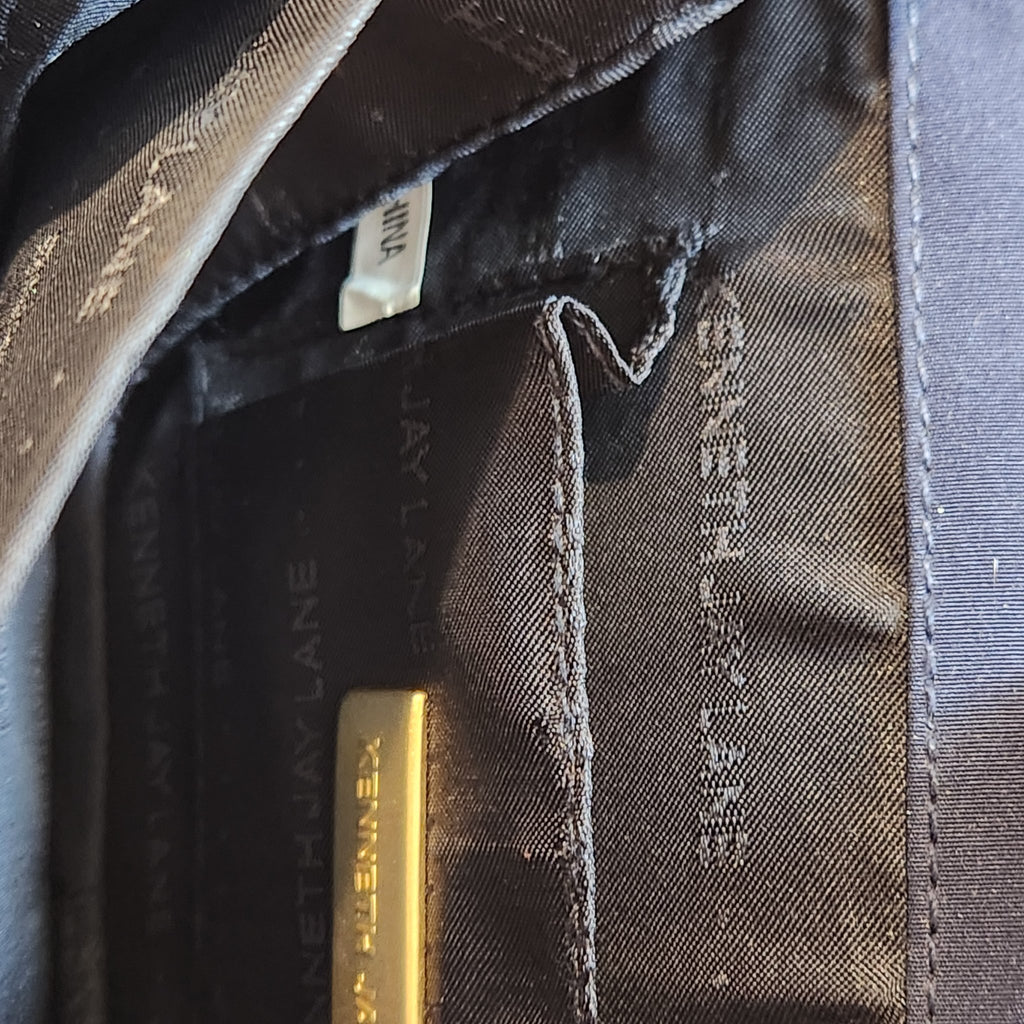 Original photo: interior of the bag showing the Kenneth Jay Lane branded lining and gold designer plaque