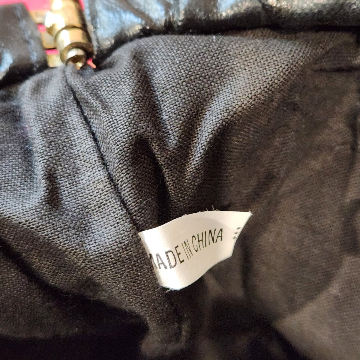 Original photo: close-up of the interior tag reading MADE IN CHINA