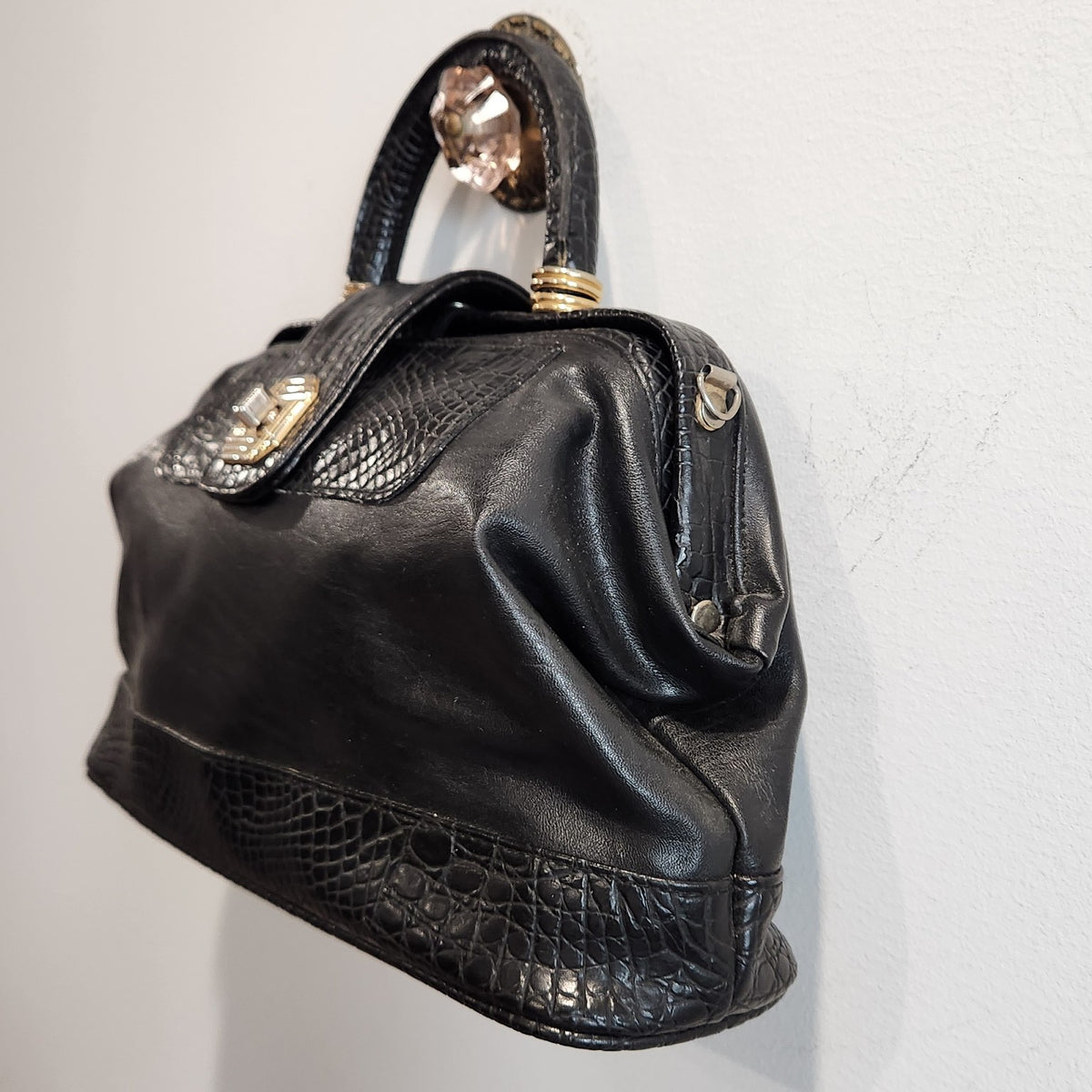 LaTique black satchel, three-quarter side profile