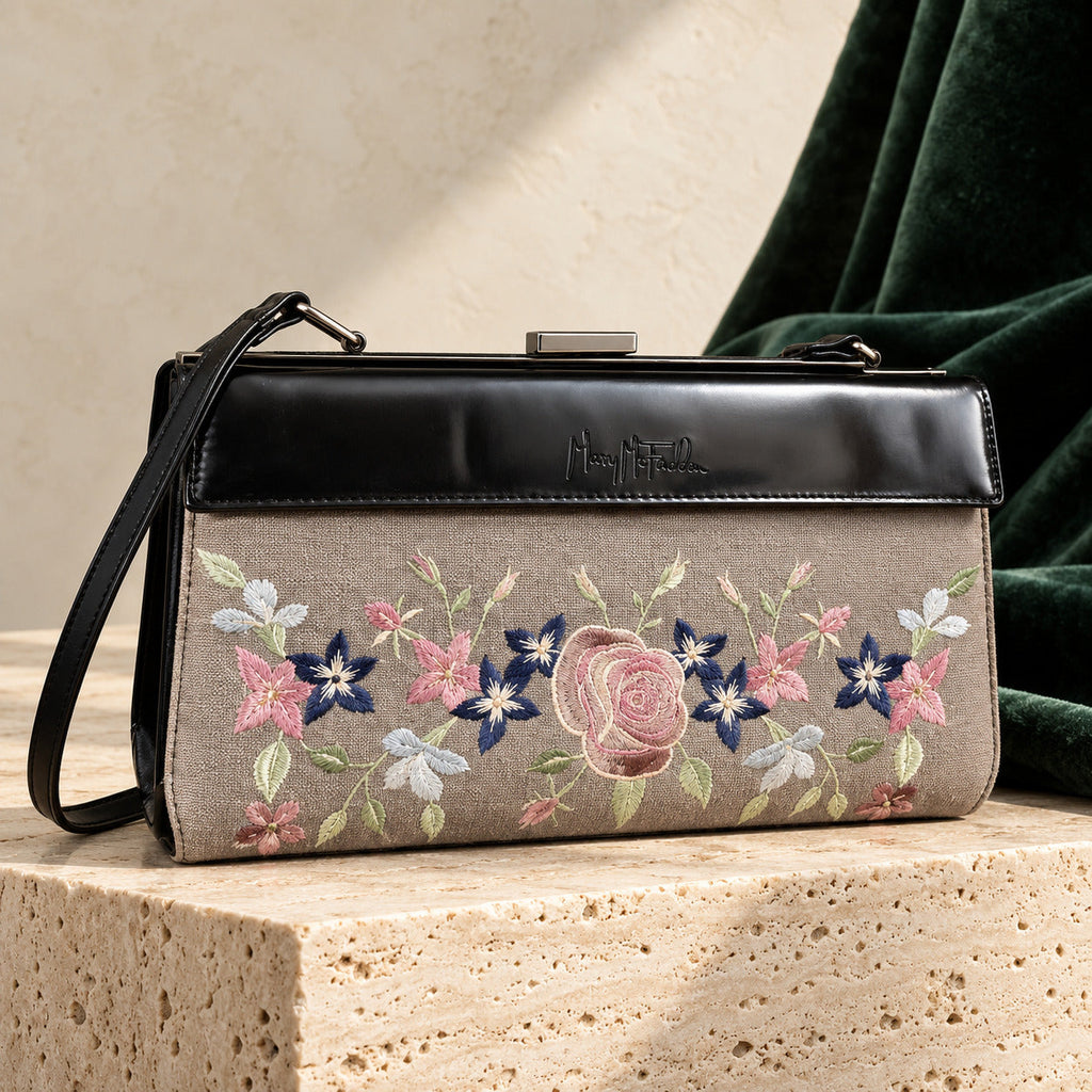 Mary McFadden vintage 3-in-1 handbag with floral panel on cream stone, editorial-enhanced image