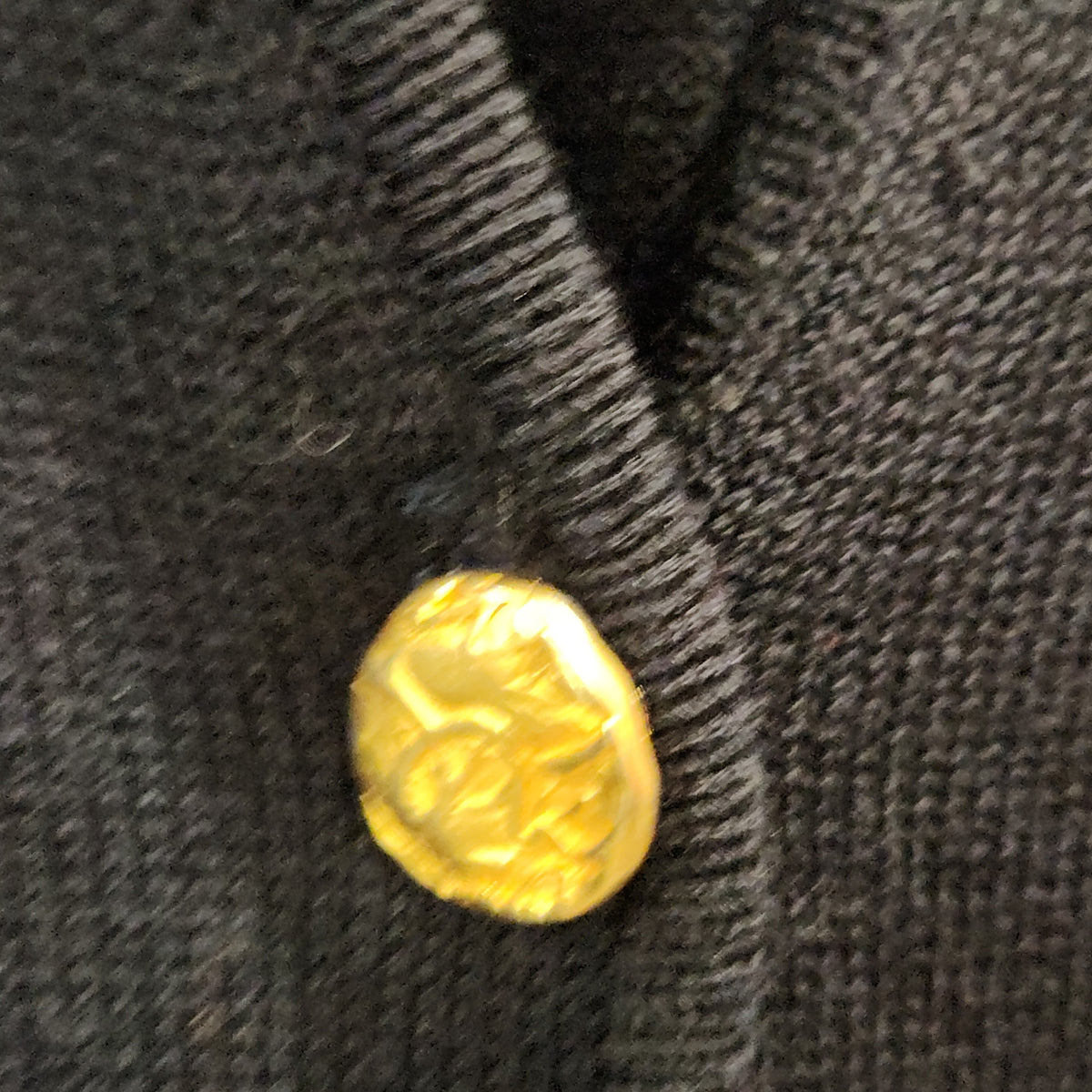 Lucille Golden Vintage, LLC black Donna Karan New York cardigan with a textured gold-tone button on fine-knit fabric.
