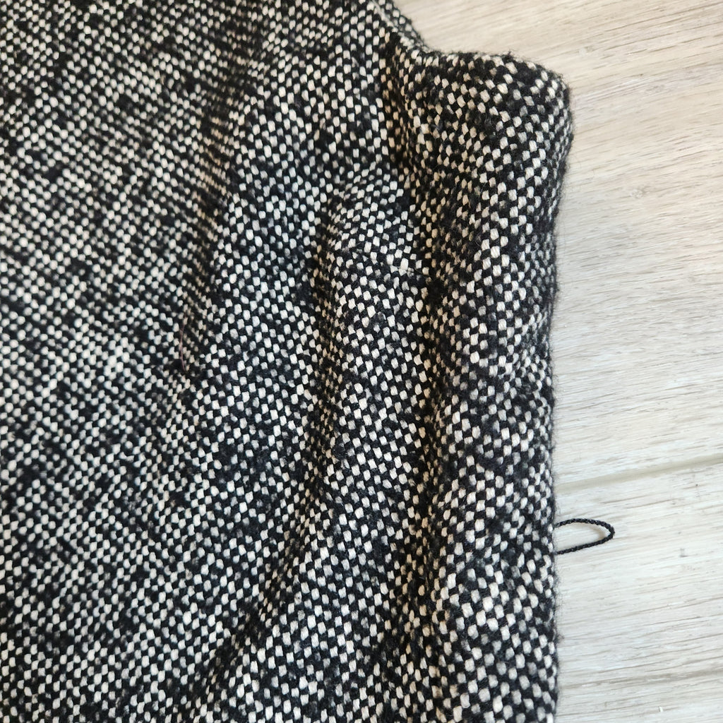 Lucille Golden Vintage, LLC black and white textured tweed fabric detail of a sleeveless mini dress