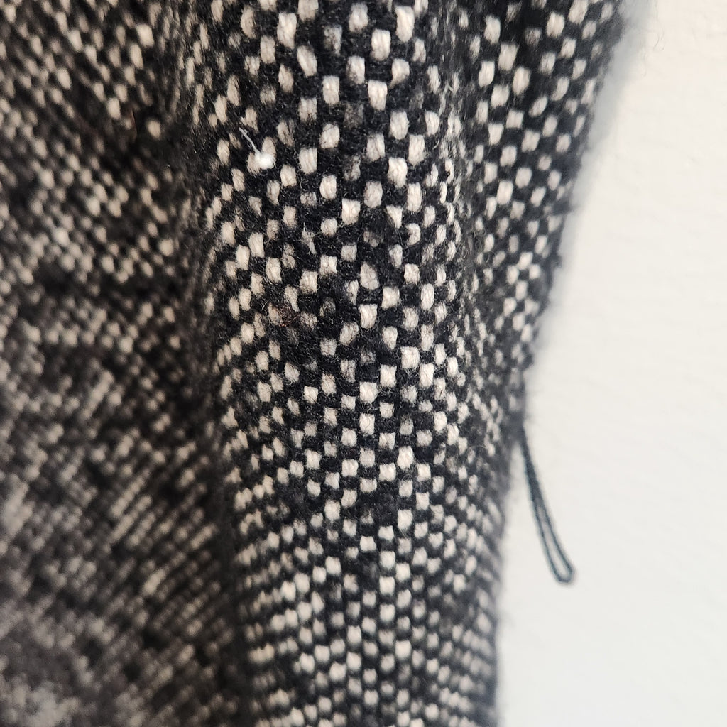Close-up of Lucille Golden Vintage, LLC MICHAEL Michael Kors black and white textured tweed fabric dress detail