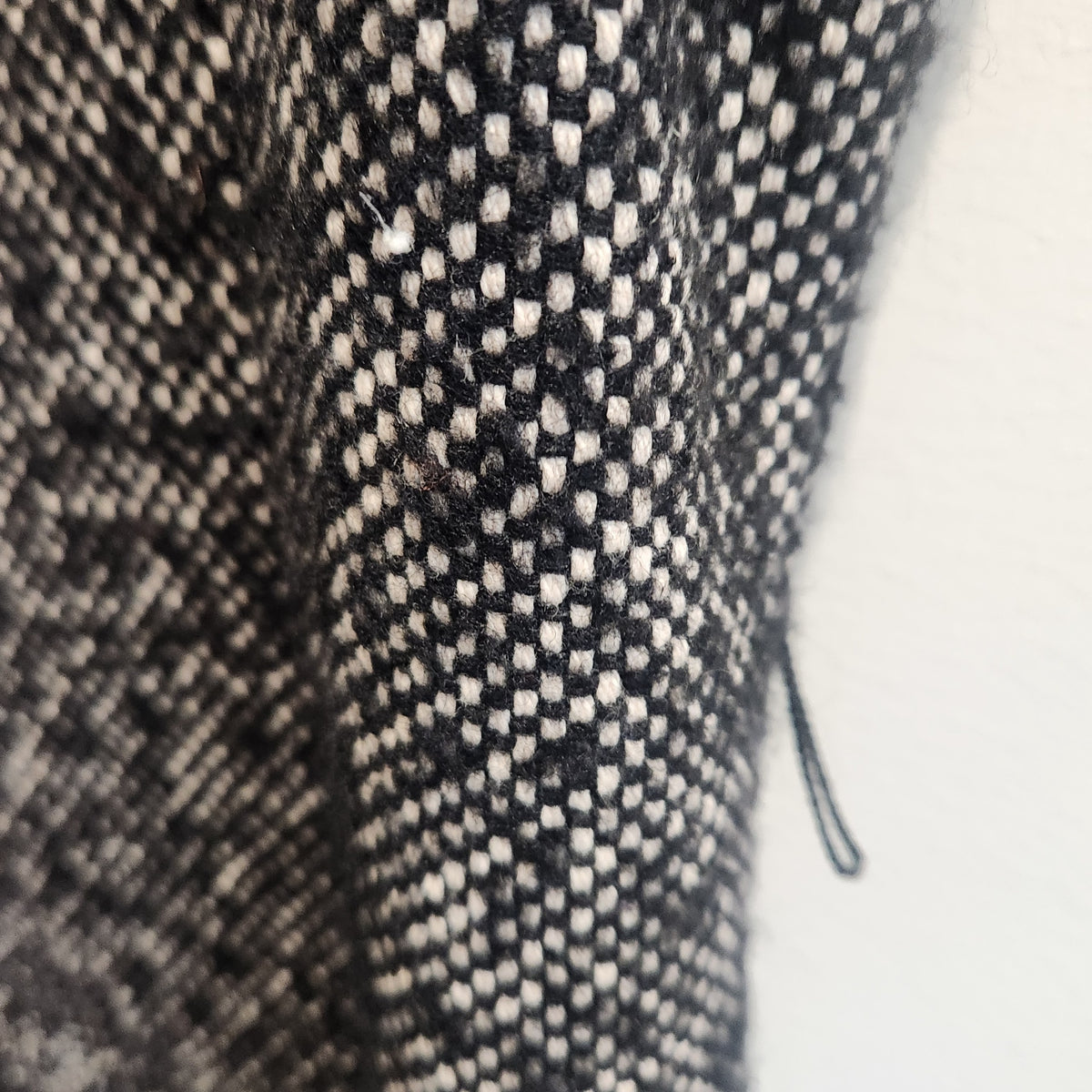 Close-up of Lucille Golden Vintage, LLC MICHAEL Michael Kors black and white textured tweed fabric dress detail