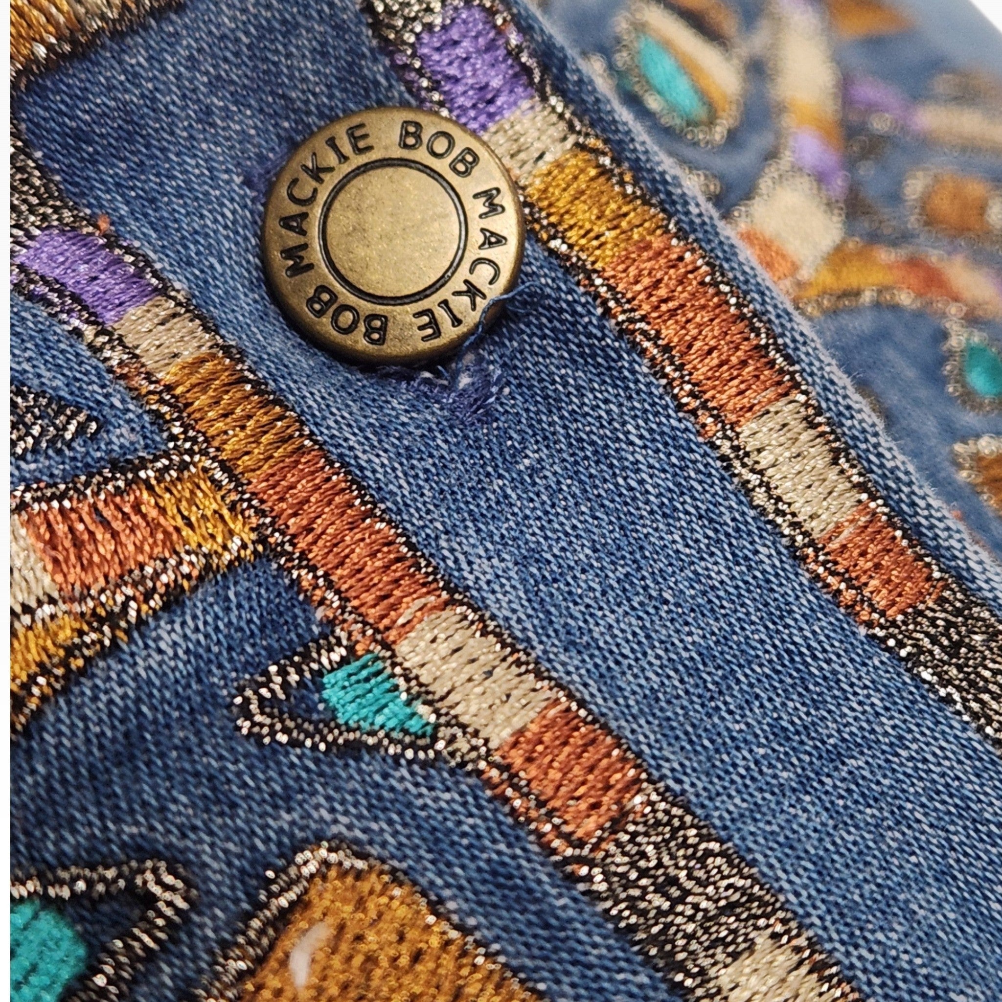 Lucille Golden Vintage, LLC Bob Mackie denim shirt featuring intricate turquoise, gold, and purple embroidery and button