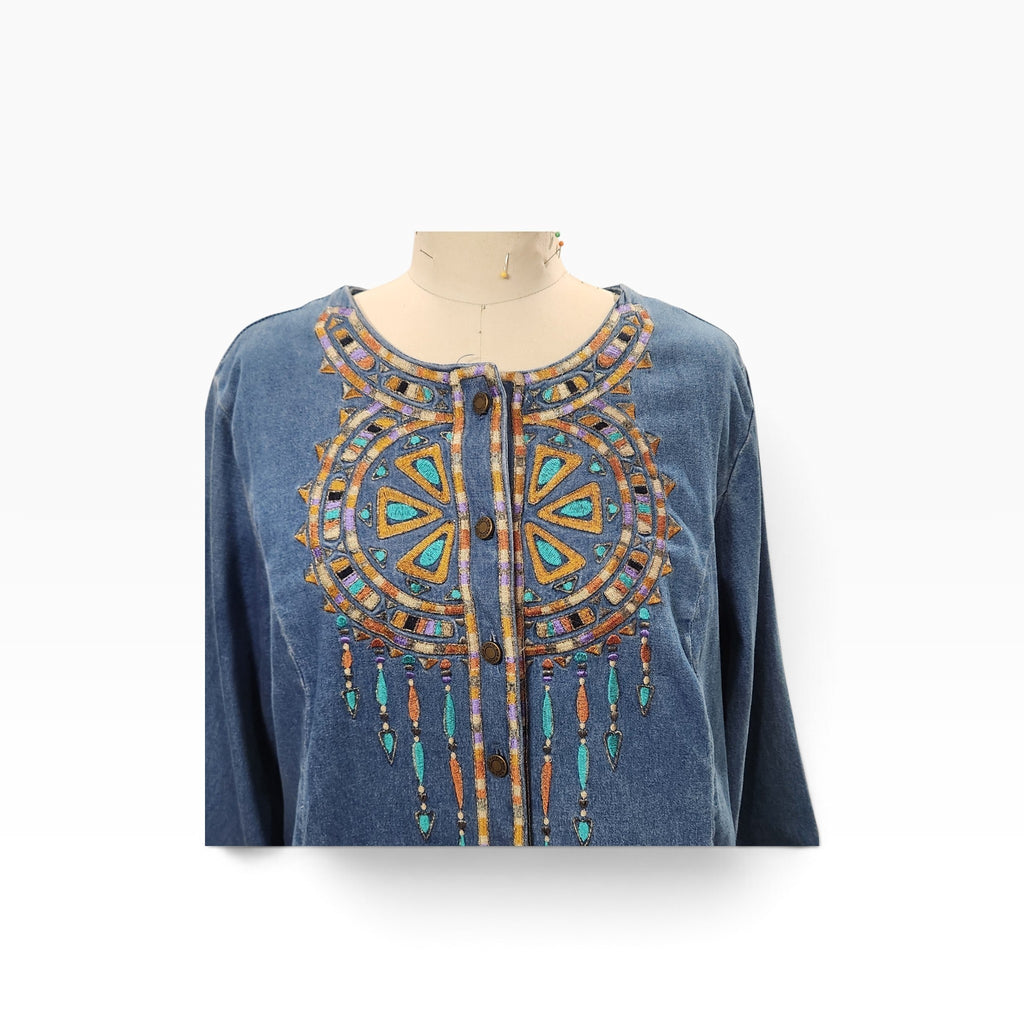 Lucille Golden Vintage, LLC Bob Mackie denim shirt with intricate turquoise, gold, and purple geometric embroidery.
