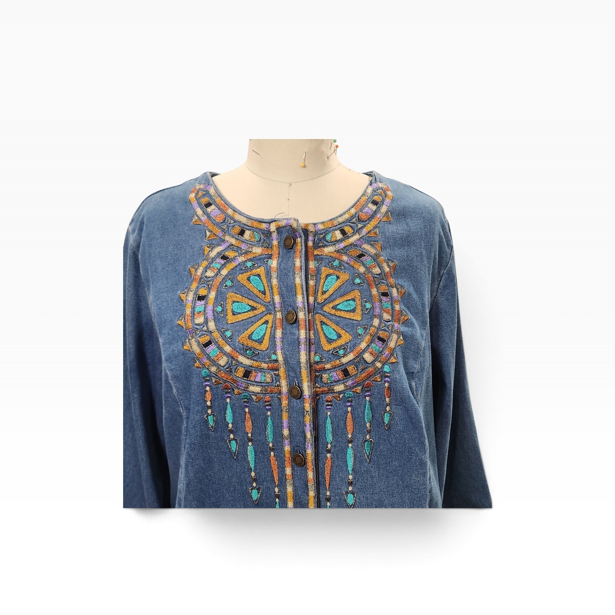 Lucille Golden Vintage, LLC Bob Mackie denim shirt with intricate turquoise, gold, and purple geometric embroidery.