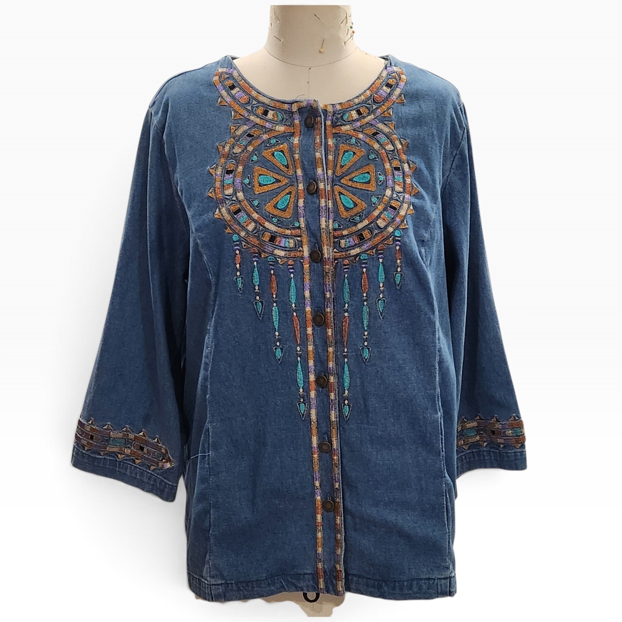 Lucille Golden Vintage, LLC Bob Mackie denim shirt with intricate turquoise and gold embroidery on a mannequin