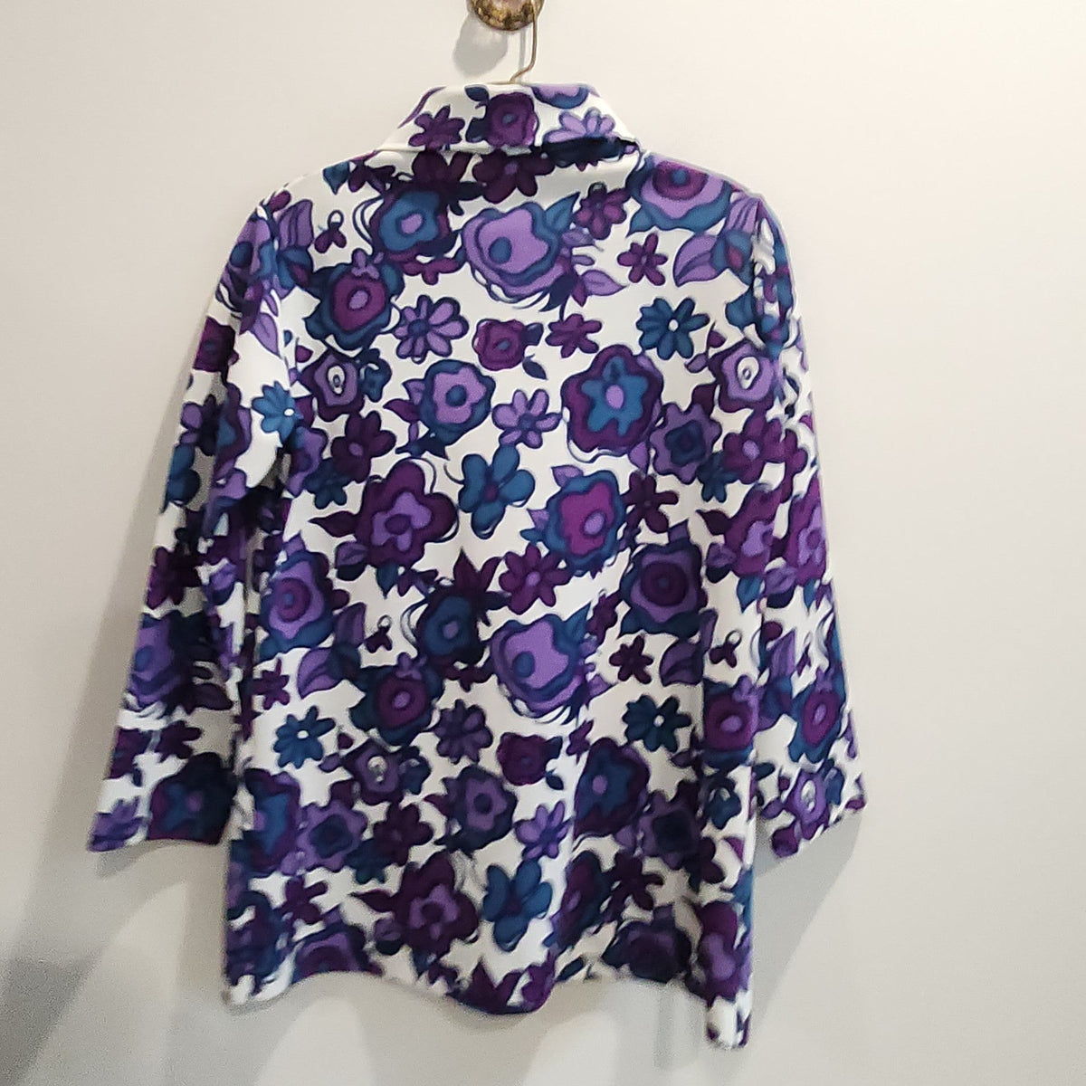 Lucille Golden Vintage, LLC long-sleeve button-down shirt with a vibrant purple, violet, and teal floral print.