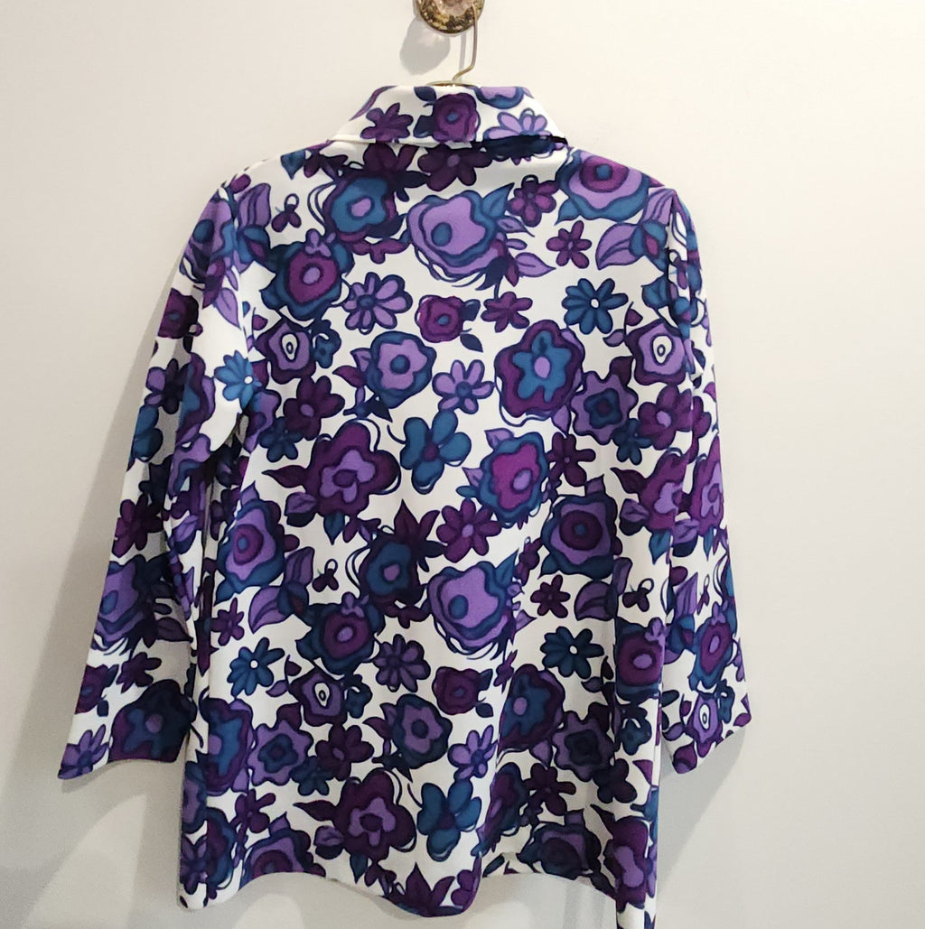 Lucille Golden Vintage, LLC button-down shirt featuring a vibrant purple, violet, and teal floral print on white.