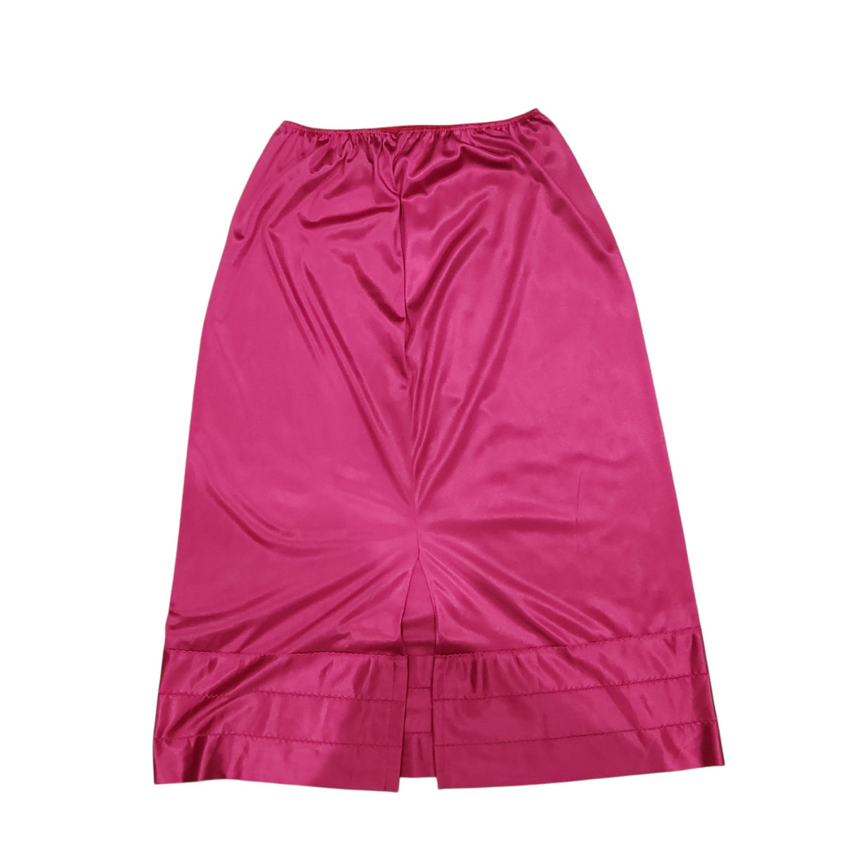 Lucille Golden Vintage, LLC fuchsia satin half slip with an elastic waistband and subtle hem stitching details.