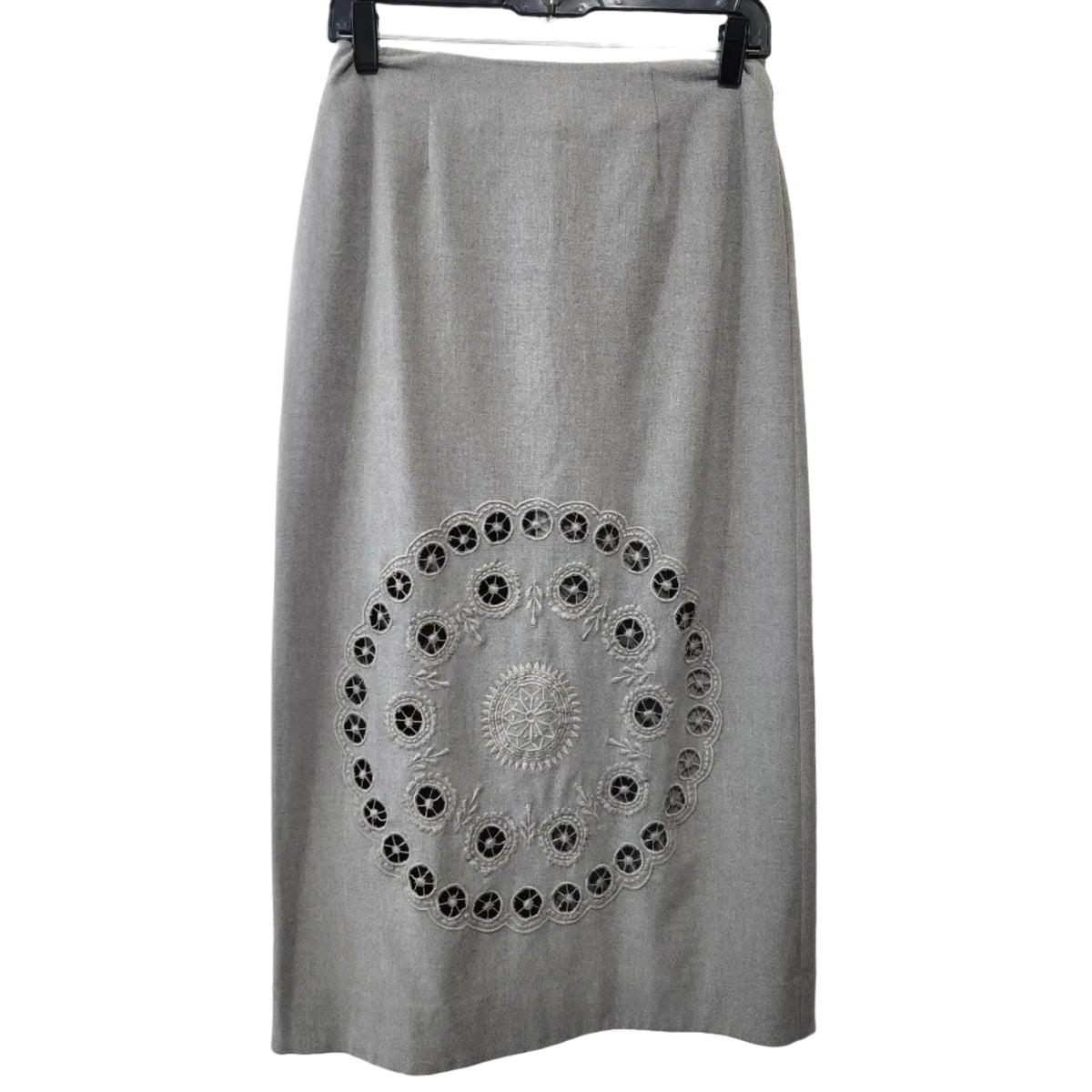 Lucille Golden Vintage, LLC grey midi skirt featuring intricate circular laser-cut embroidery on a tailored silhouette.