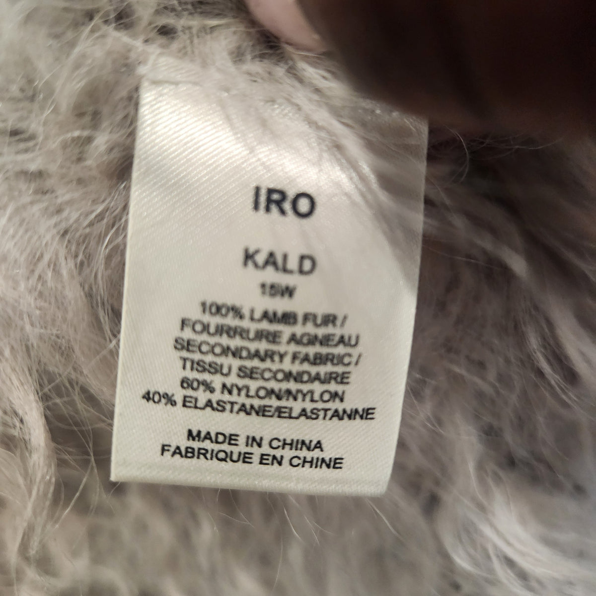 Lucille Golden Vintage, LLC IRO Kald lamb fur jacket care and material label showing fabric composition details