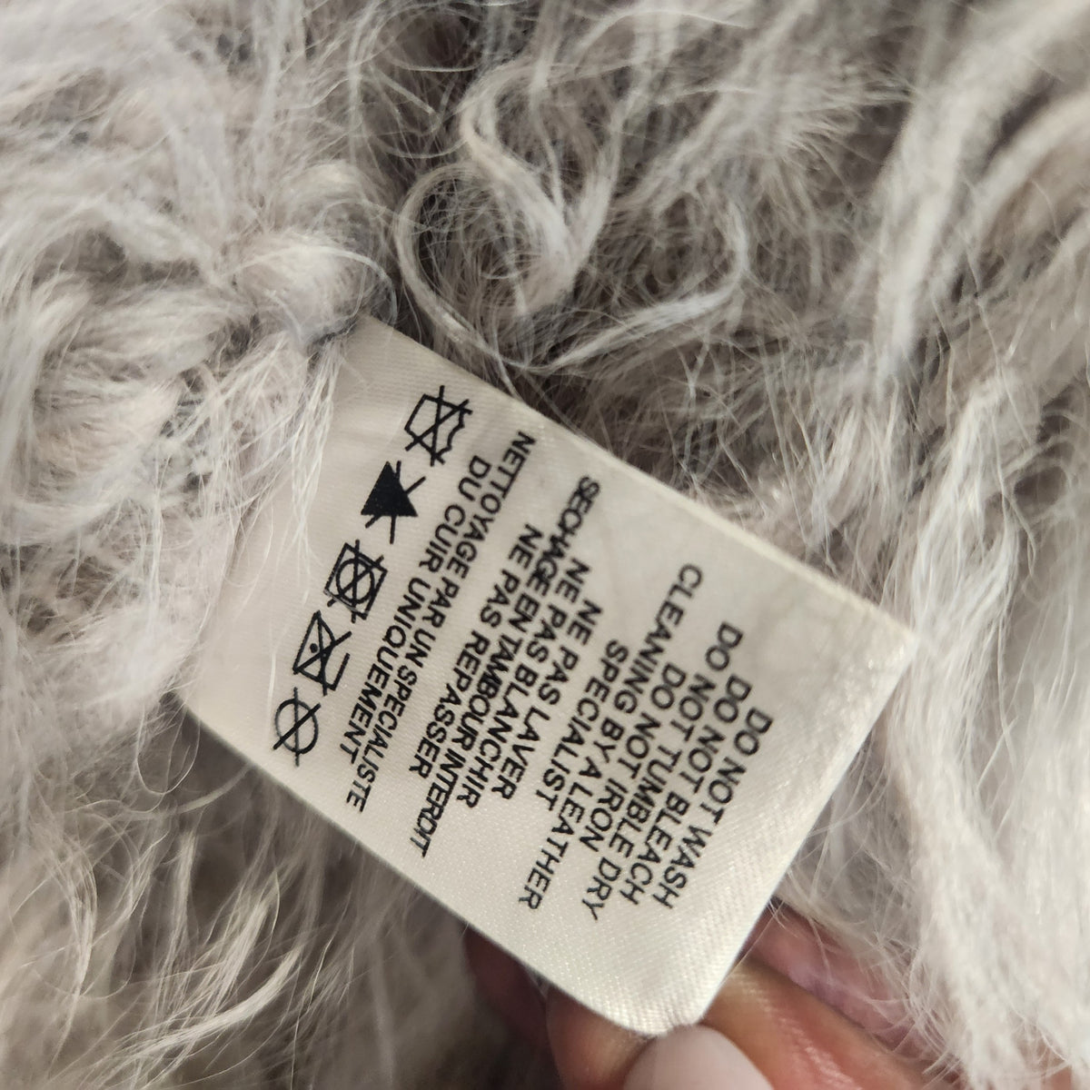 Lucille Golden Vintage, LLC IRO lamb fur jacket care label with professional leather cleaning instructions