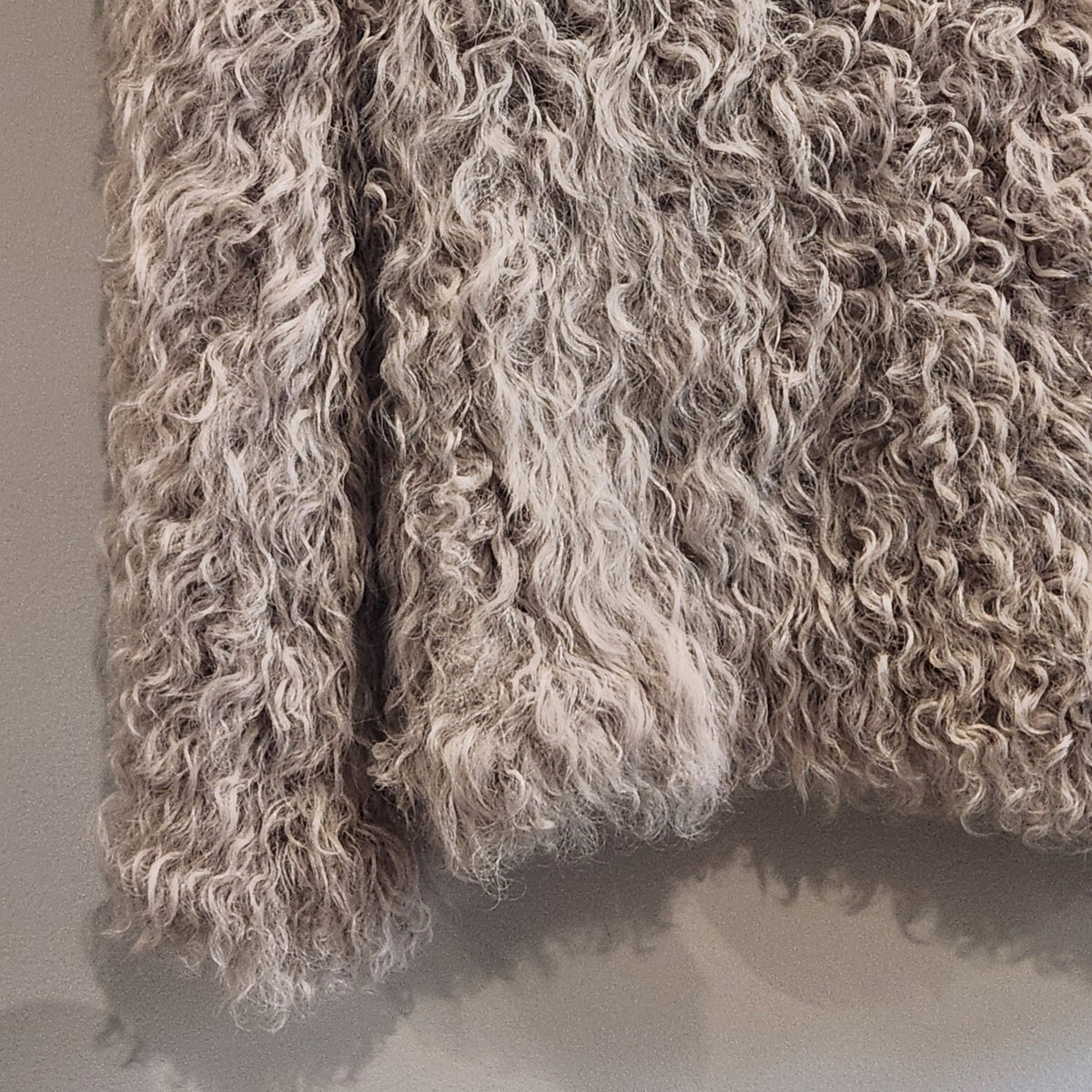 Lucille Golden Vintage, LLC IRO lamb fur jacket featuring a shaggy curly texture in a neutral beige tone.