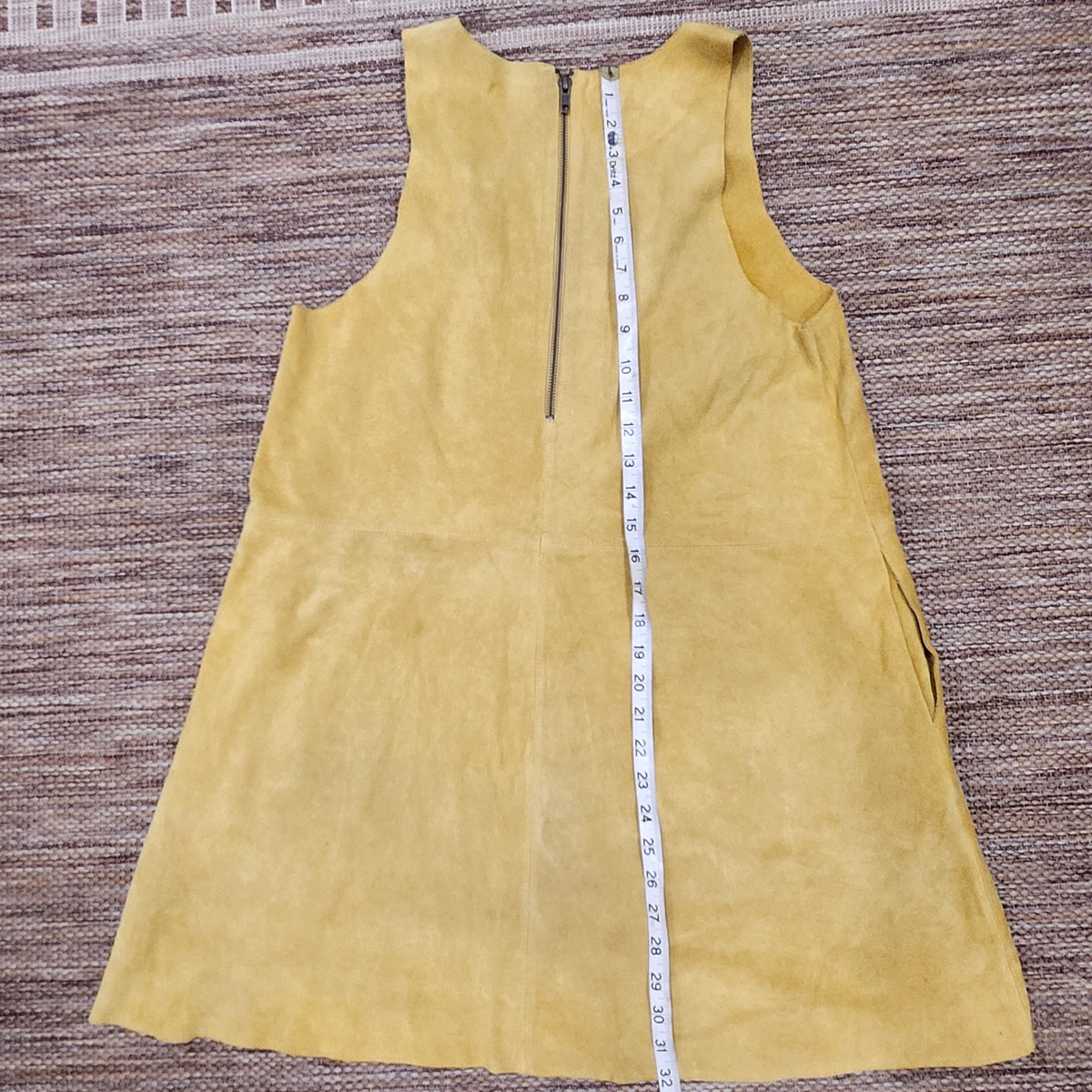 Lucille Golden Vintage, LLC mustard yellow suede mini dress with back zipper and measuring tape for length reference
