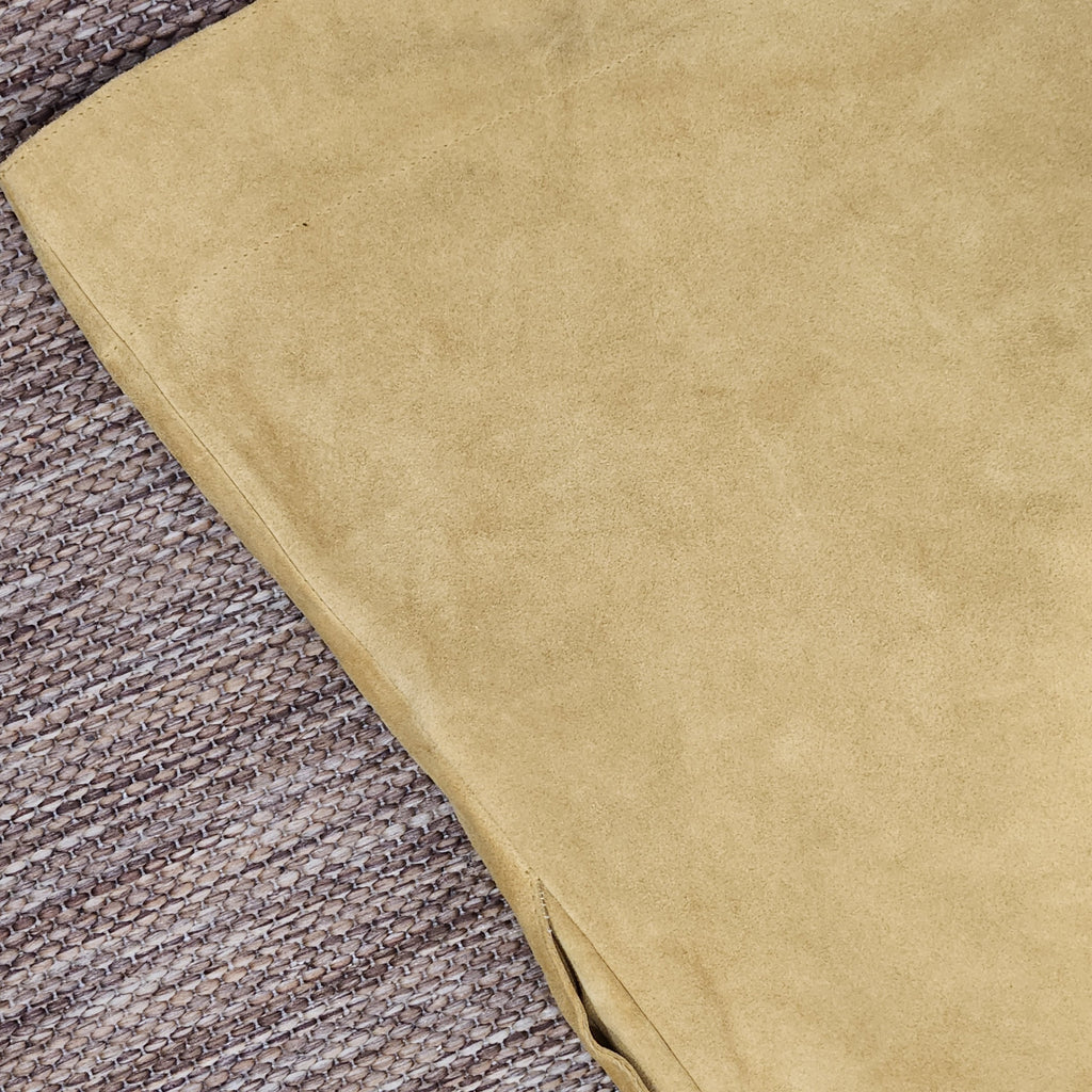 Close-up of mustard yellow suede fabric from a Lucille Golden Vintage, LLC mini dress showing soft texture.