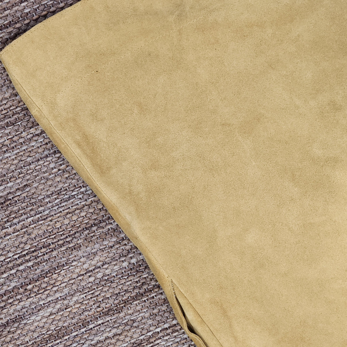 Close-up of mustard yellow suede fabric from a Lucille Golden Vintage, LLC mini dress showing soft texture.