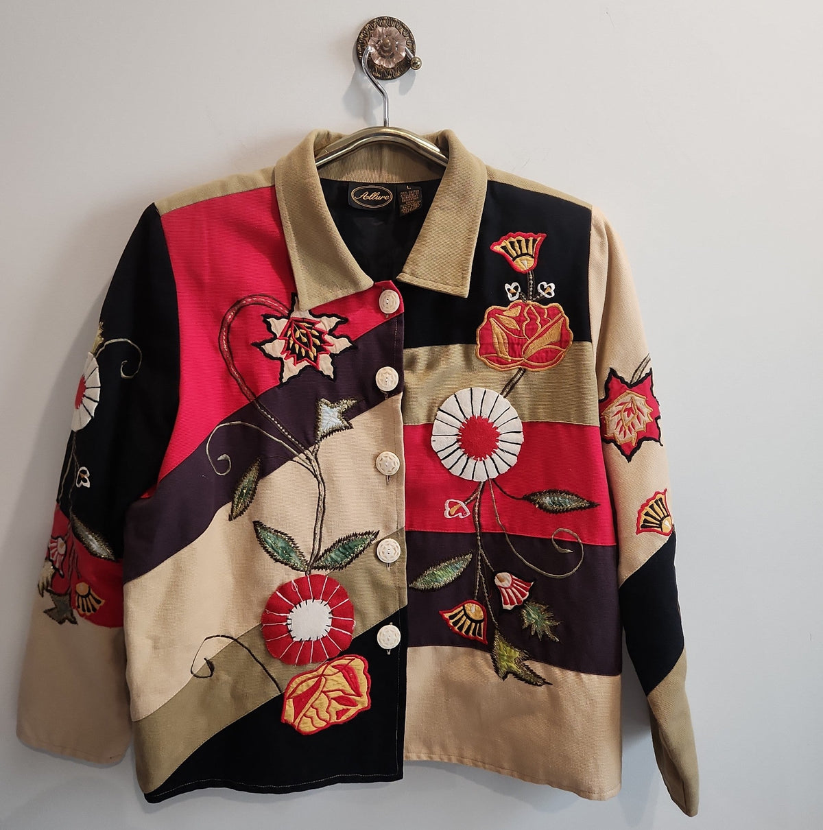 Lucille Golden Vintage, LLC patchwork button-up jacket in tan, black, and red with intricate floral embroidery.