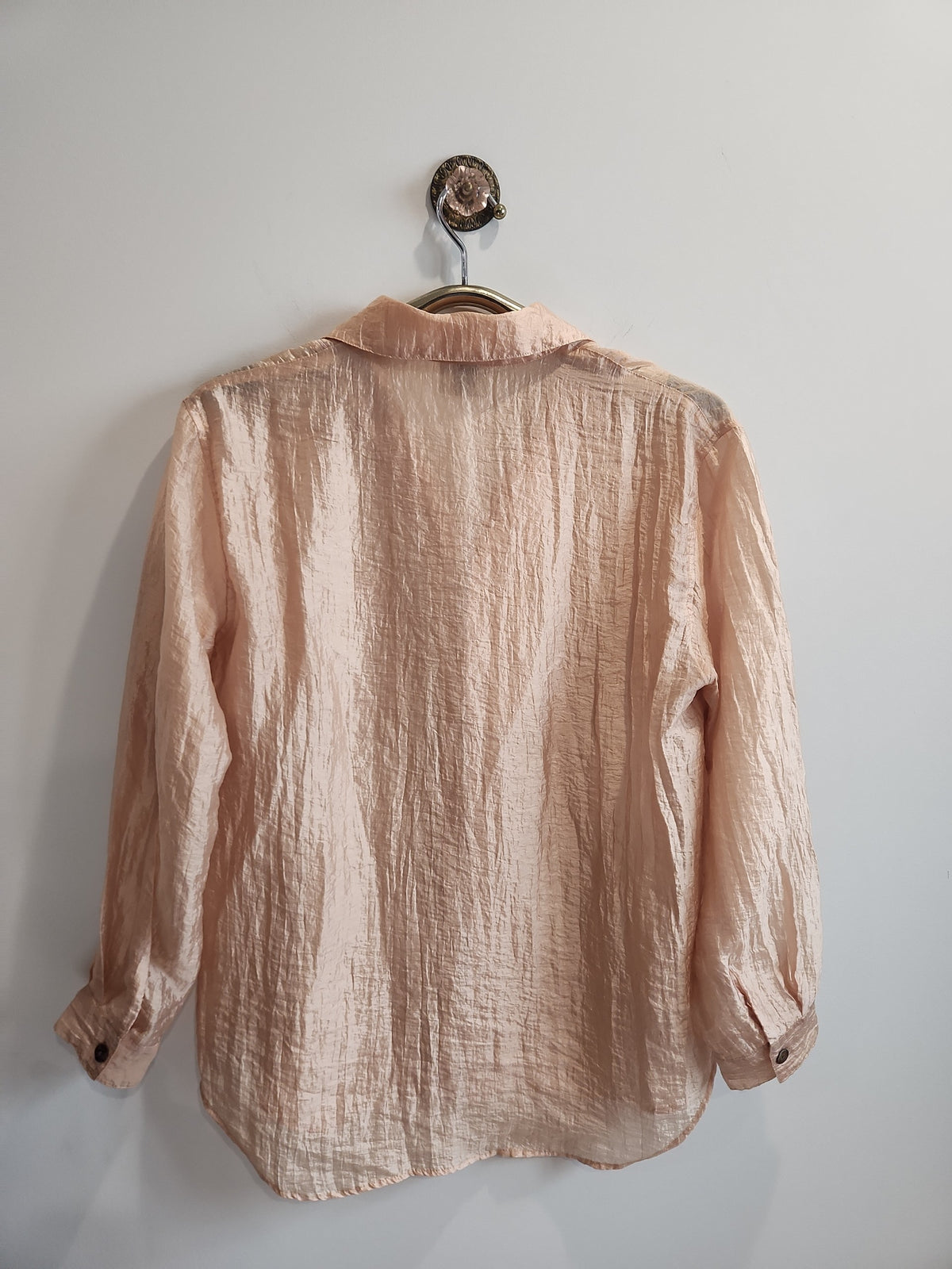 Lucille Golden Vintage, LLC peach crinkled long sleeve button-down shirt with a classic collar and semi-sheer fabric.