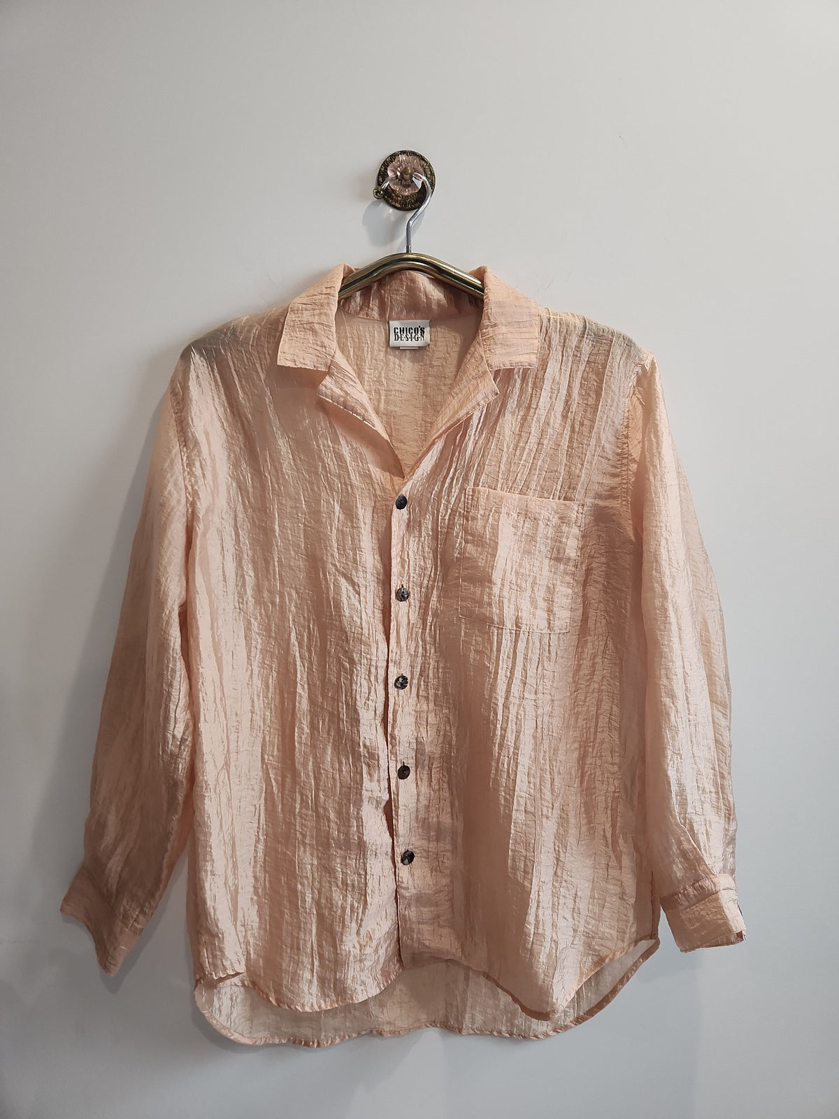 Lucille Golden Vintage, LLC peach crinkled button-down shirt with long sleeves and a chest pocket.