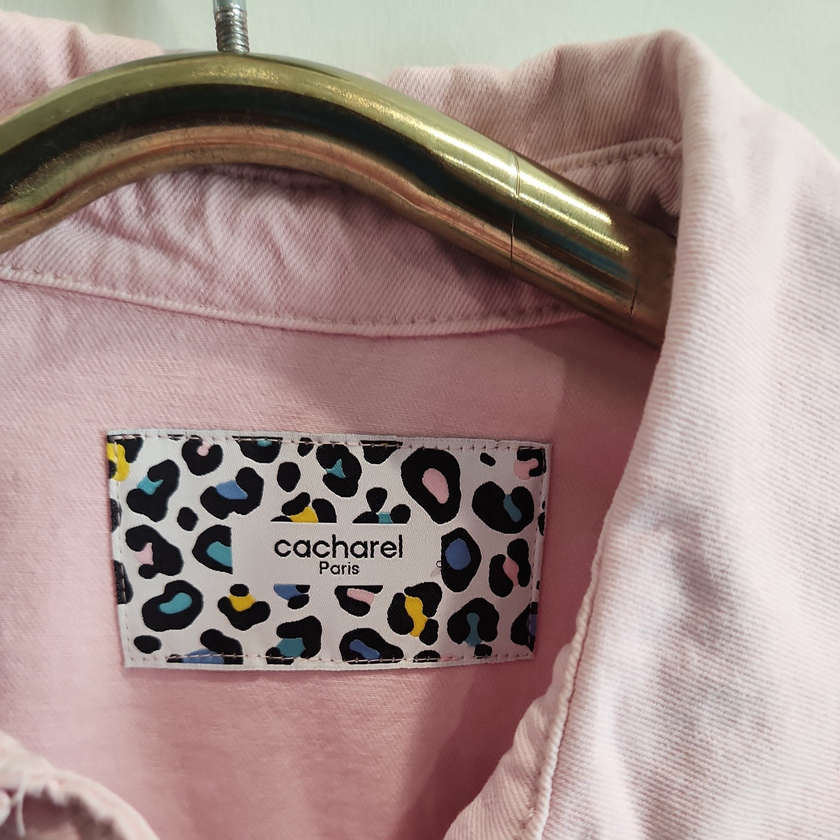 Lucille Golden Vintage, LLC pastel pink denim jacket featuring a Cacharel Paris label with leopard print detail