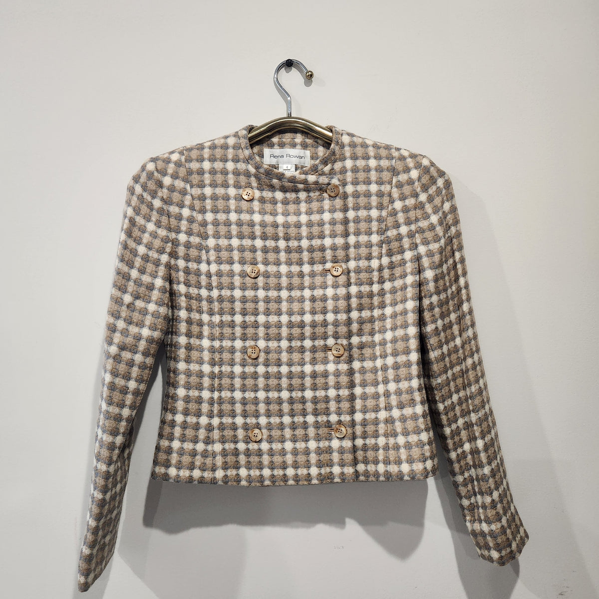 Lucille Golden Vintage, LLC Rena Rowan collarless double-breasted blazer in a beige and grey textured check pattern.