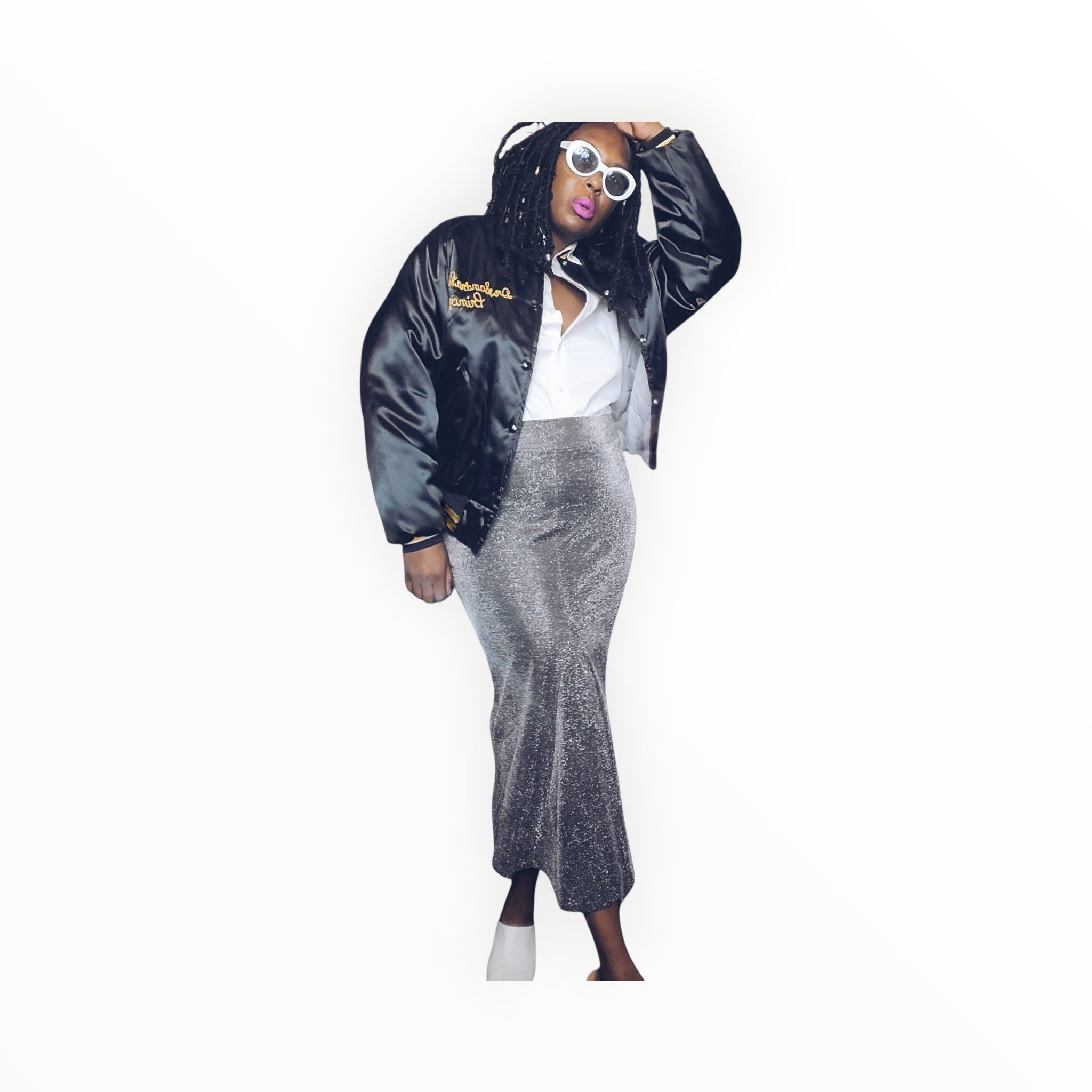 Lucille Golden Vintage, LLC silver metallic mermaid maxi skirt worn with a black bomber jacket and white sunglasses