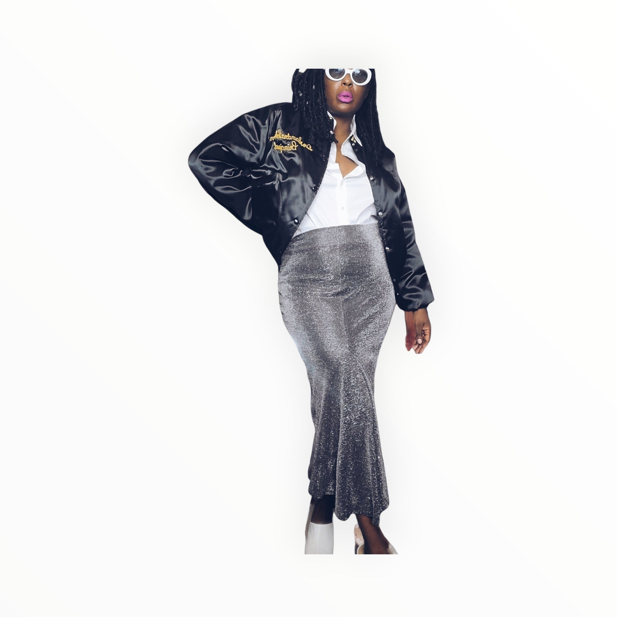 Lucille Golden Vintage, LLC model wearing a silver metallic mermaid maxi skirt with a black satin bomber jacket