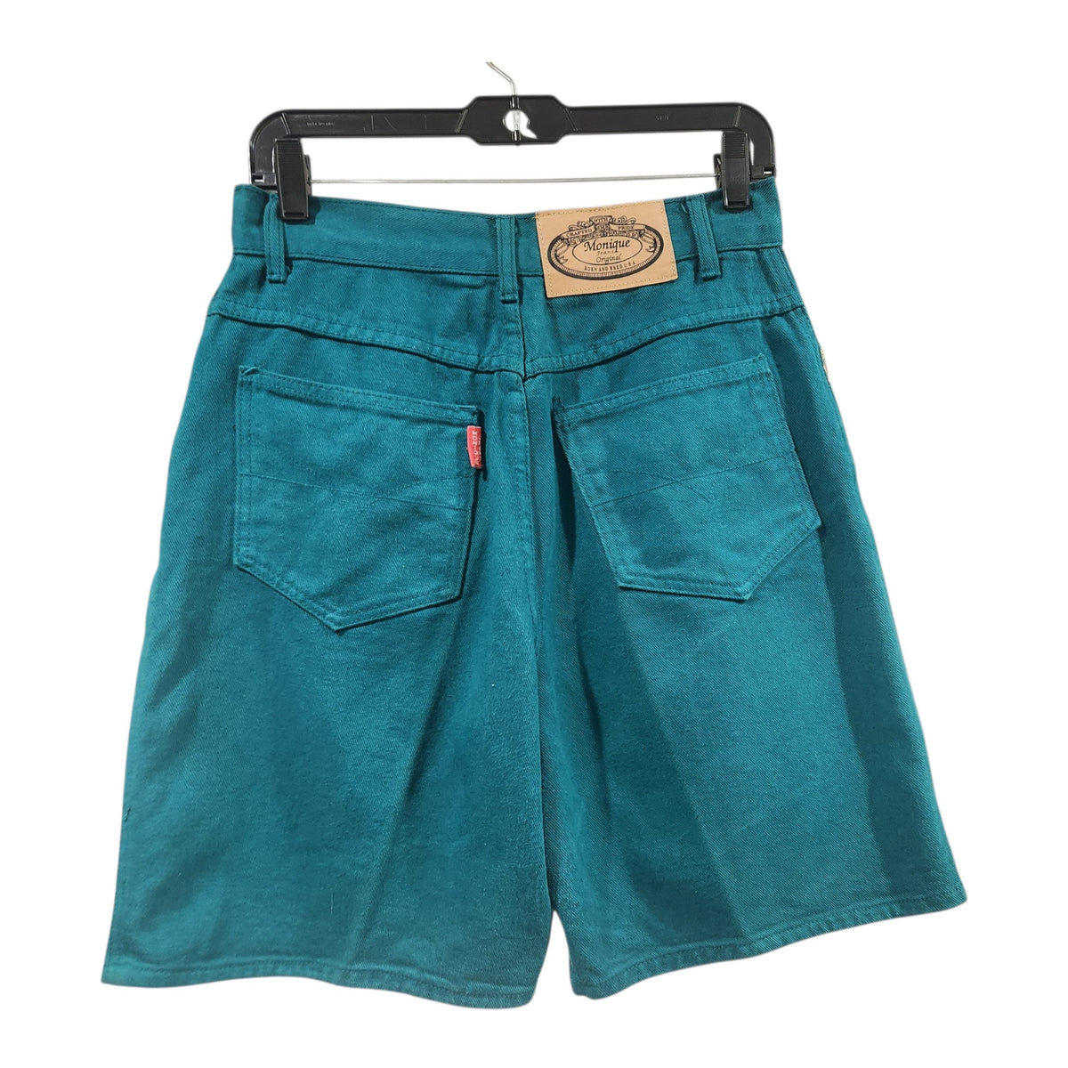 Lucille Golden Vintage, LLC teal cotton denim shorts with back pockets, leather-style brand patch, and red tab.