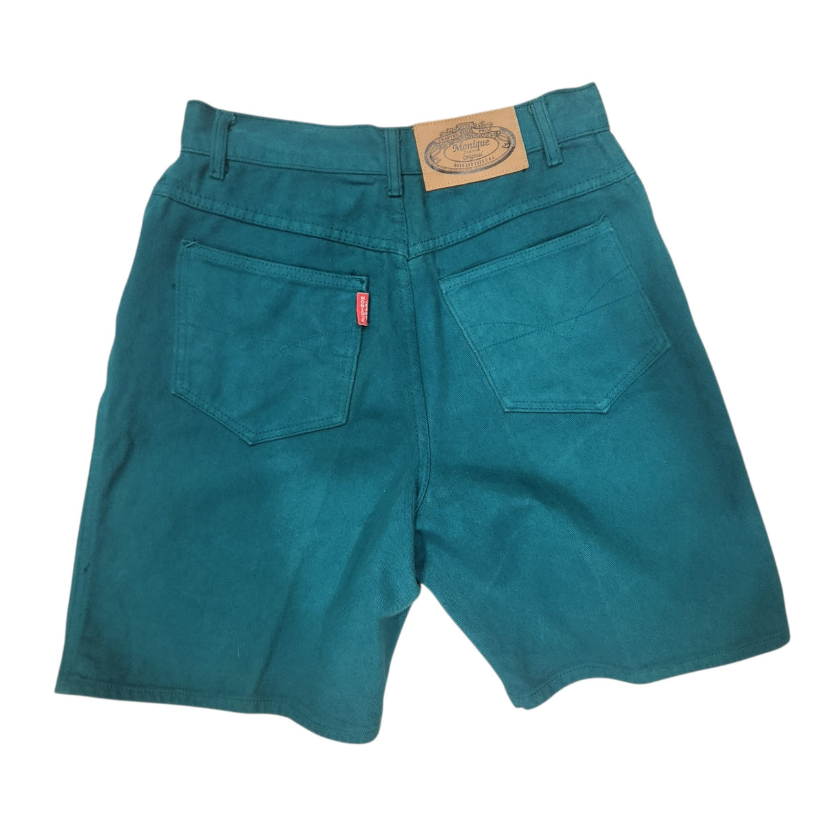 Lucille Golden Vintage, LLC teal cotton denim shorts with back pockets, leather brand patch, and signature red tab.