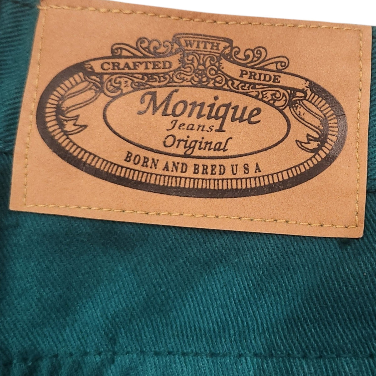 Lucille Golden Vintage, LLC Monique Jeans teal cotton denim shorts featuring a branded leather-style back waist patch.