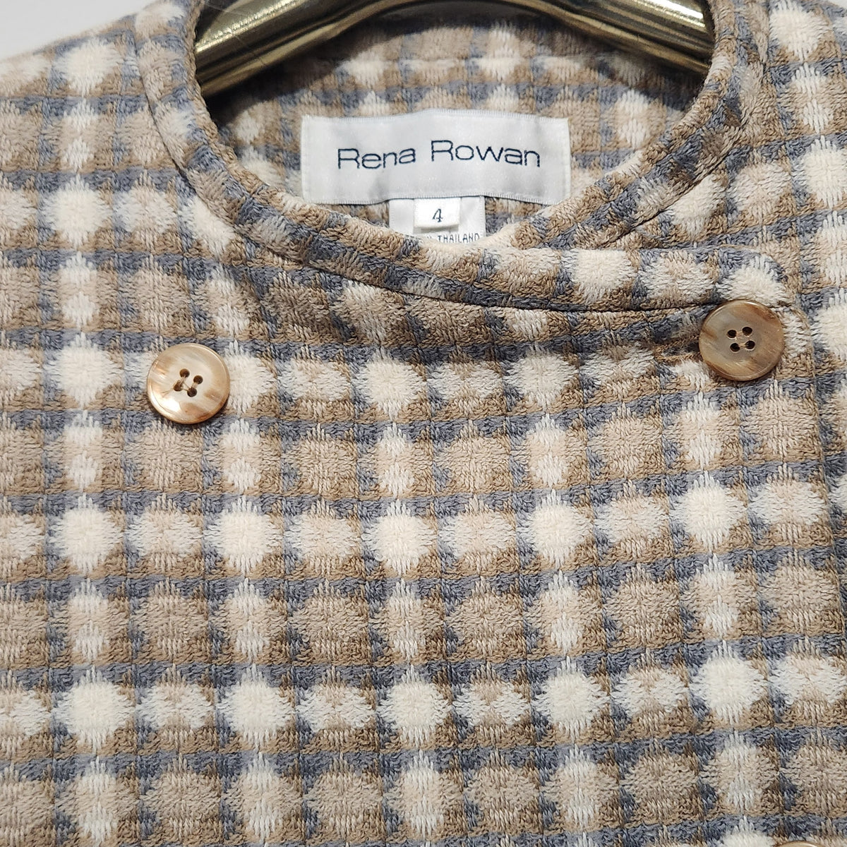 Lucille Golden Vintage, LLC Rena Rowan collarless double-breasted blazer in a beige, cream, and grey textured check.