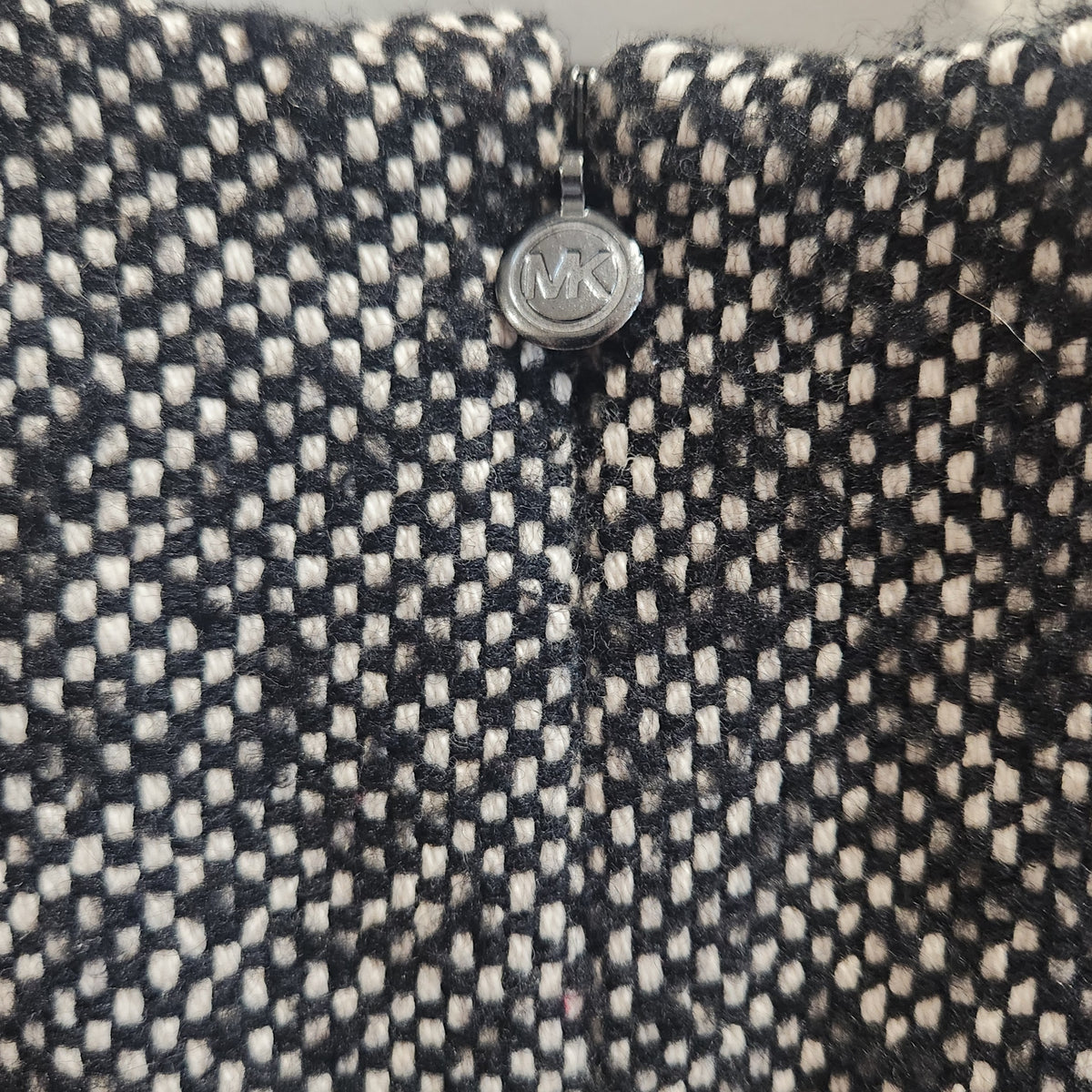 Lucille Golden Vintage, LLC black and white textured tweed fabric detail with signature MK logo zipper pull