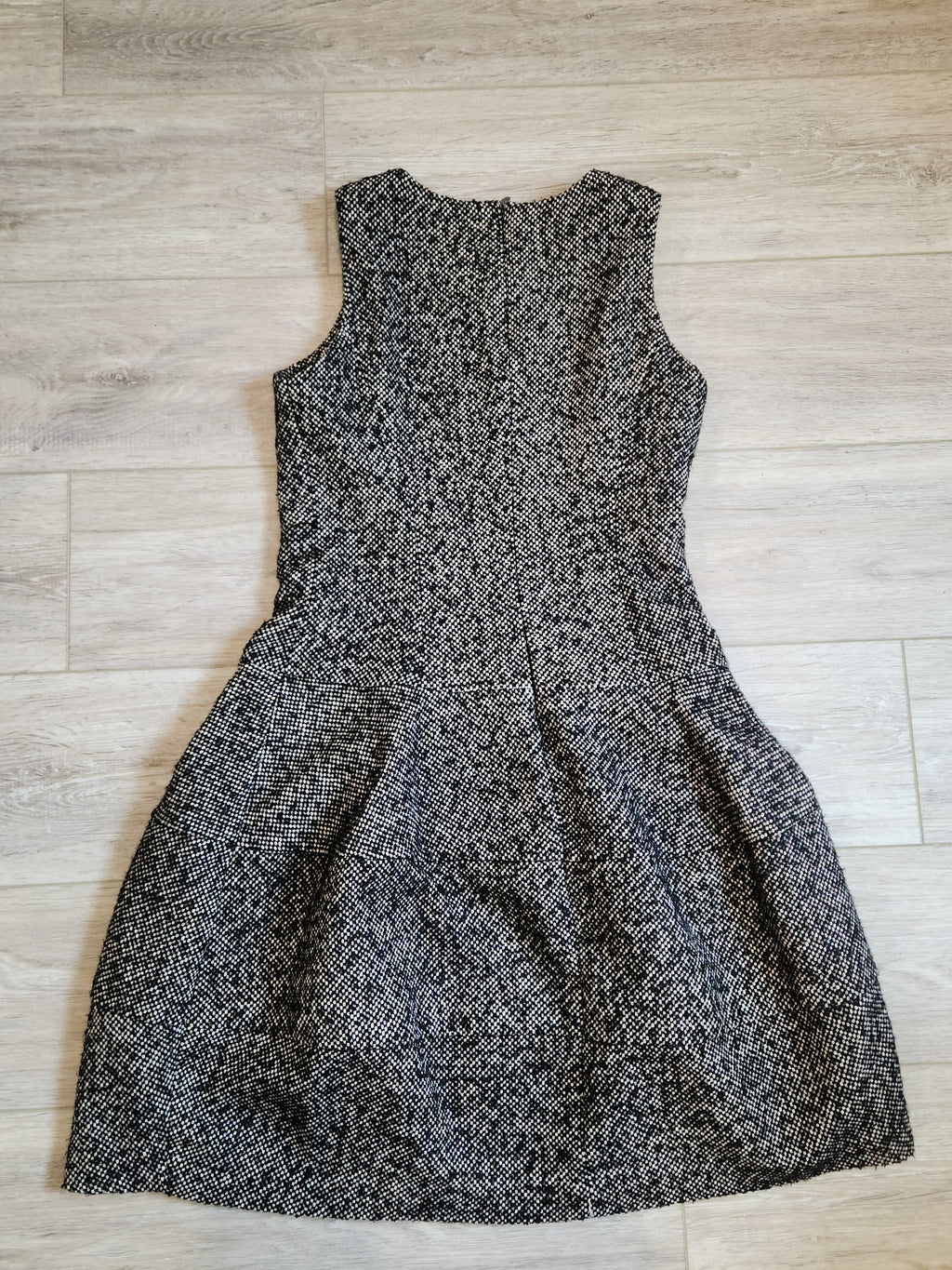 Lucille Golden Vintage, LLC sleeveless black and white textured tweed mini dress with a drop-waist silhouette.