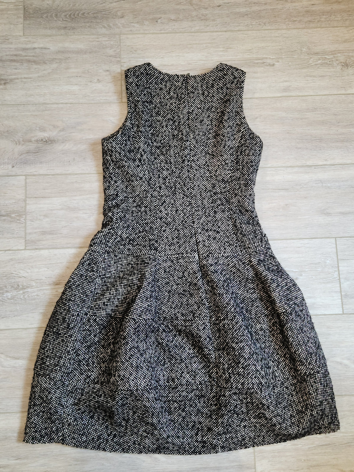 Lucille Golden Vintage, LLC sleeveless black and white textured tweed mini dress with a drop-waist silhouette.