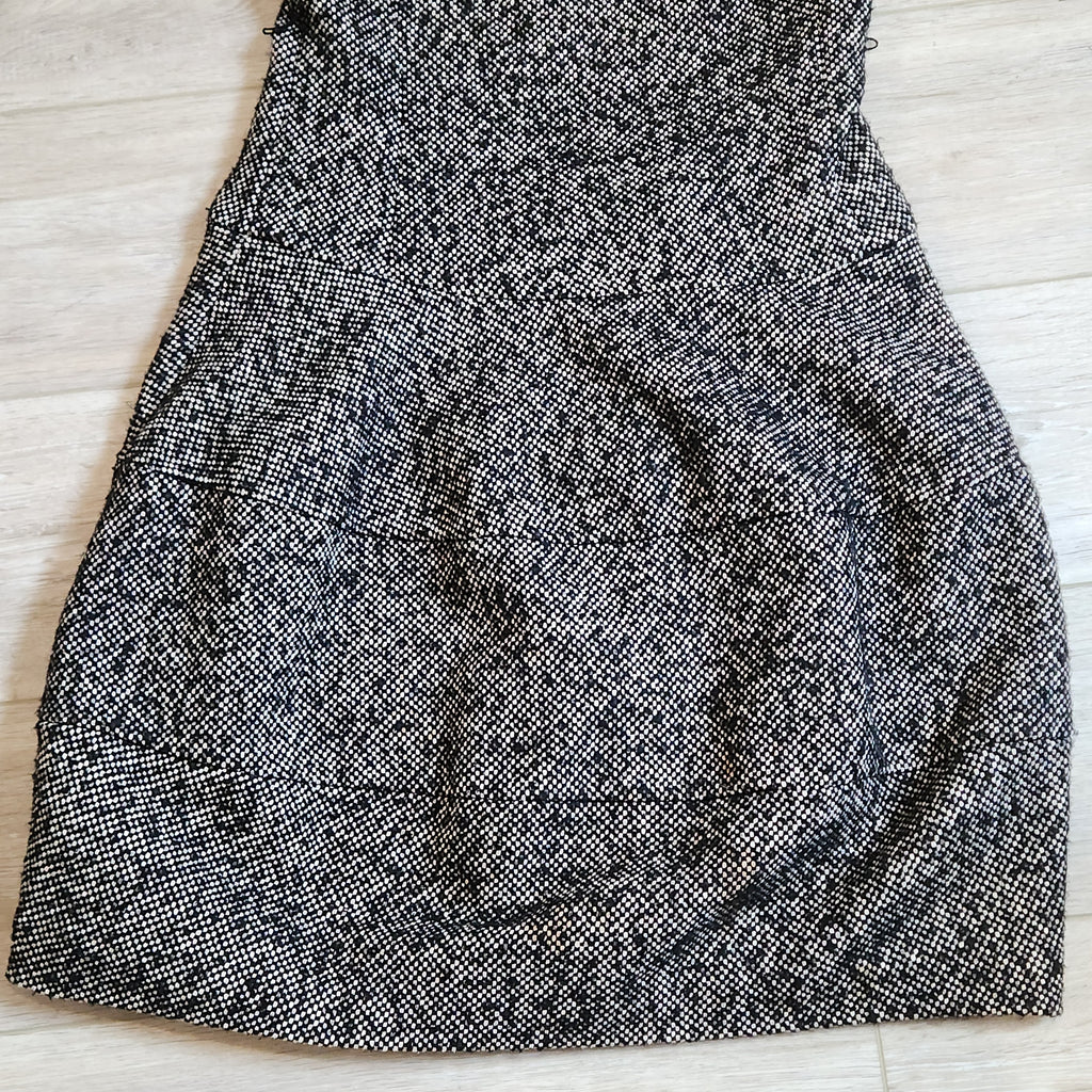 Lucille Golden Vintage, LLC black and white textured tweed mini dress with a drop-waist silhouette.
