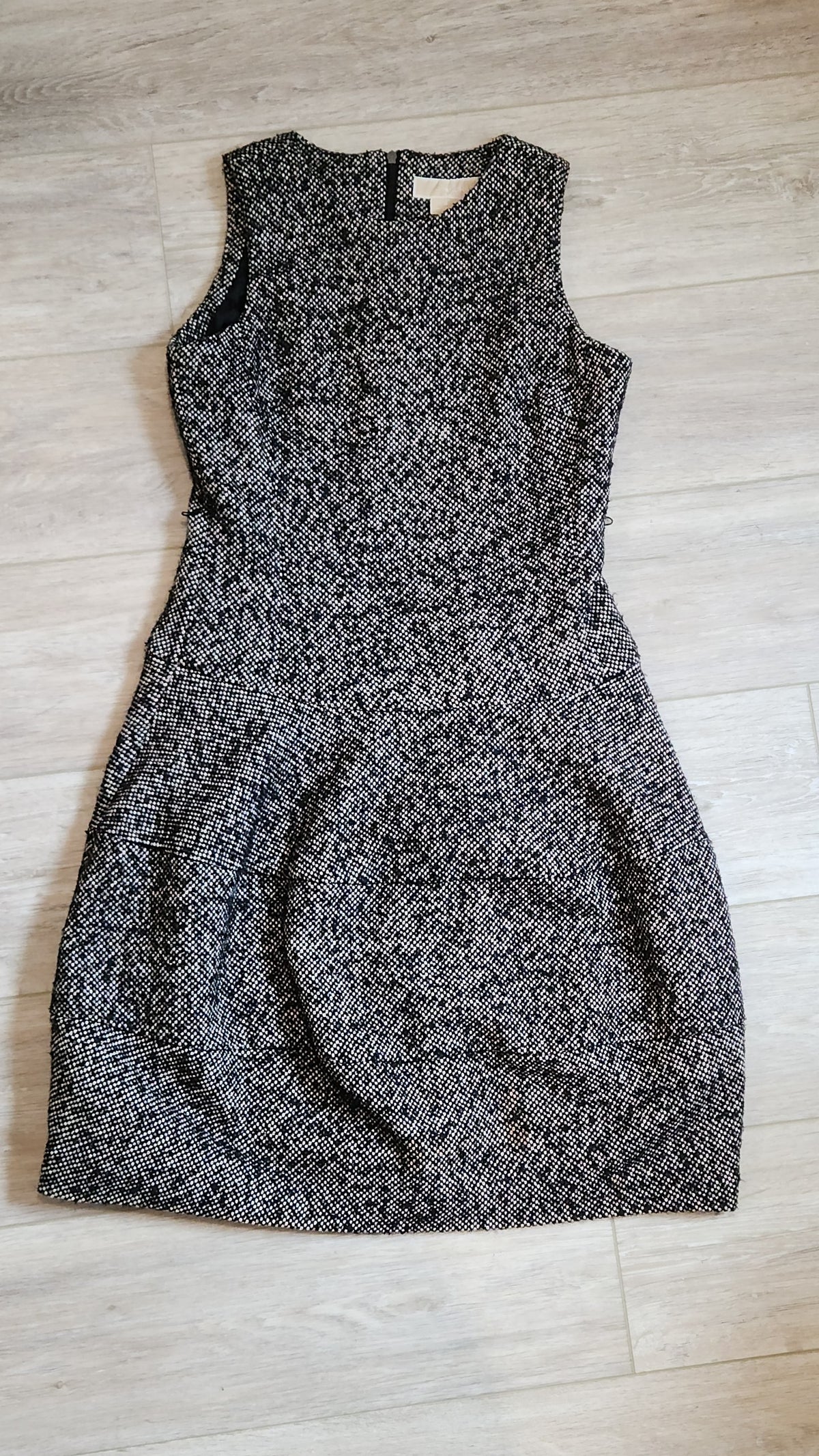 Lucille Golden Vintage, LLC sleeveless mini dress in black and white textured tweed with a drop-waist silhouette.