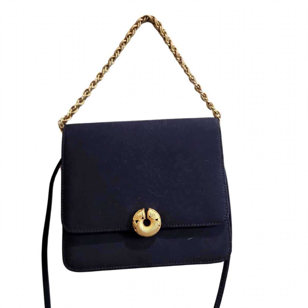Vintage Kenneth Jay Lane midnight navy flap bag on a white background, front view, gold chain arranged above the bag
