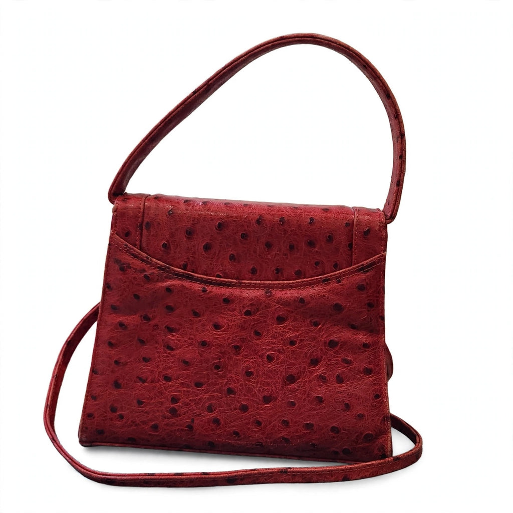 Back view of vintage Mike's Collection red ostrich-embossed leather mini handbag on a white background, showing the exterior slip pocket